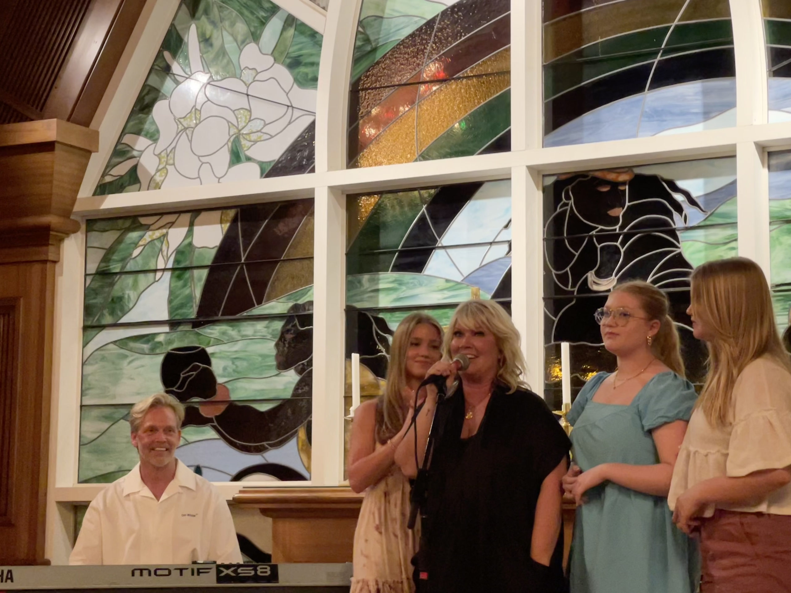 Natalie Grant, Bernie Herms, and daughters performing at the 2023 Maui Songwriter's Festival 